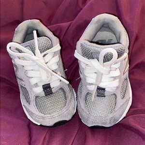 Gray New Balance® Kids IK888v2 sneakers.